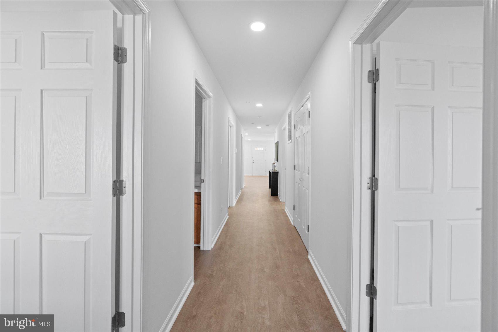 313 Homberg Avenue Baltimore, MD 21221 - Photo 42 of 47 a view of a hallway with a wooden floor