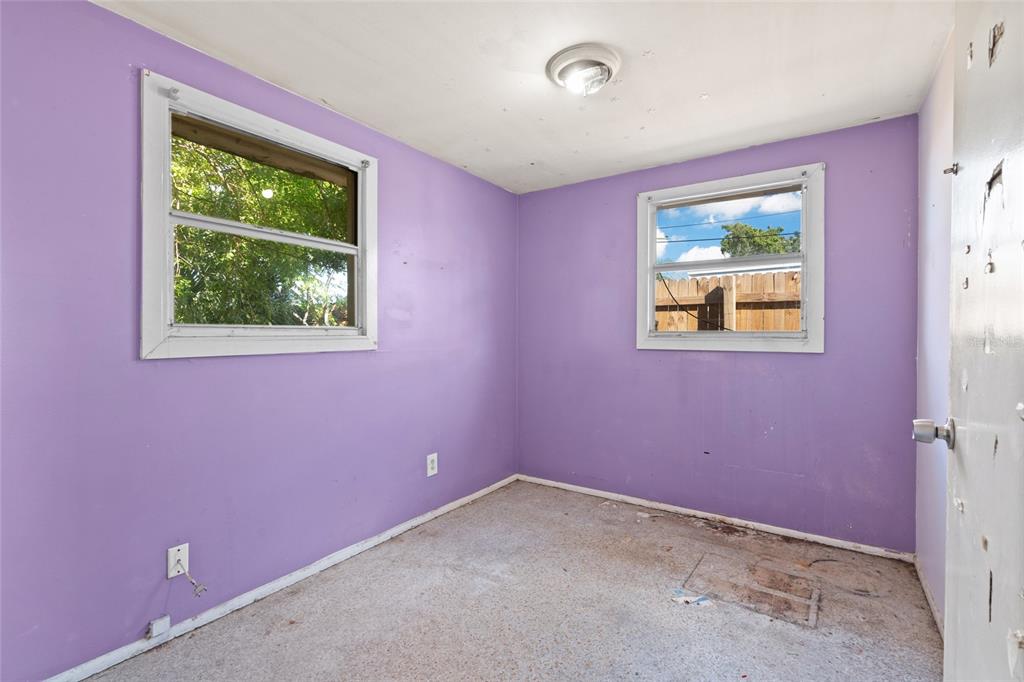 11982 106th Street Largo, FL 33778 - Photo 17 of 29 a view of an empty room with a window
