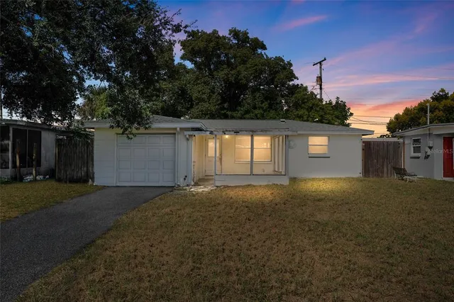 an aerial view of a house with a lake view