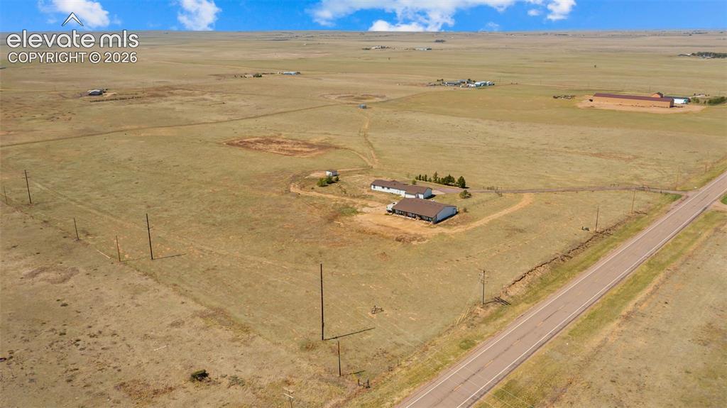 33975 Highway 94 Yoder, CO 80864 - Photo 36 of 40 Expansive rural property featuring a main residence, an additional structure, and a roadway border