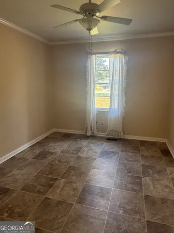 a view of an empty room and window