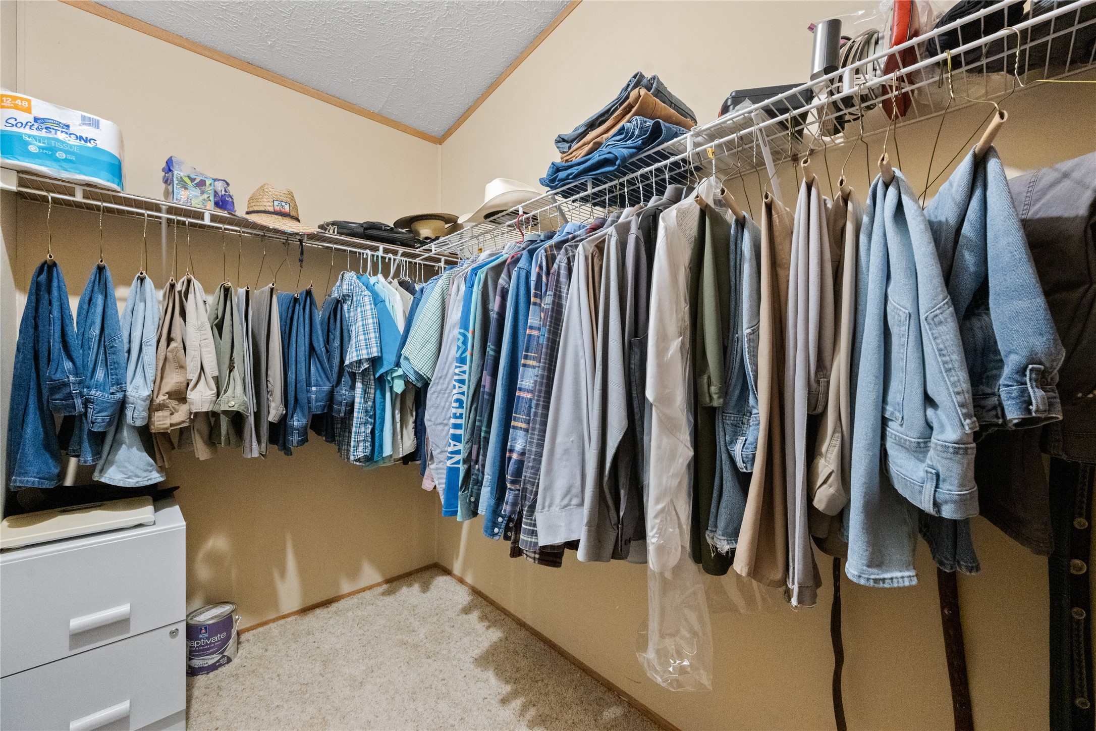 290 County Road 2286 Cleveland, TX 77327 - Photo 16 of 37 a view of walk in closet with clothes and shoes