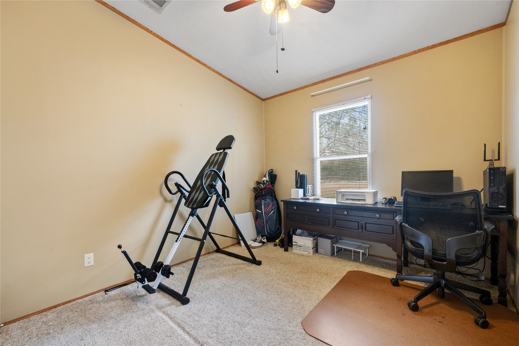 290 County Road 2286 Cleveland, TX 77327 - Photo 19 of 37 a view of a workspace with furniture and a window