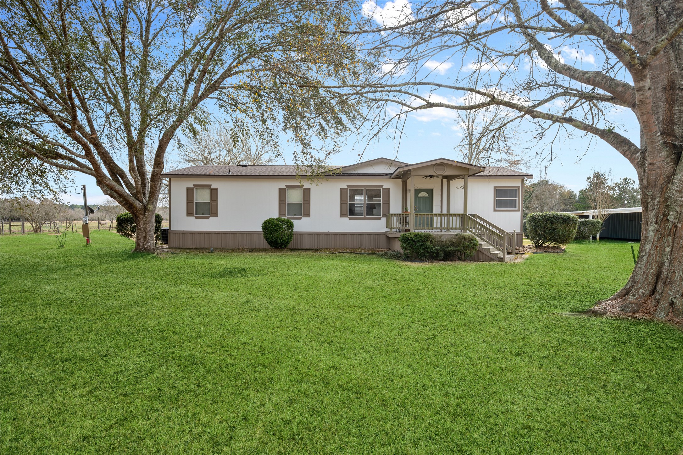 290 County Road 2286 Cleveland, TX 77327 - Photo 29 of 37 a front view of house with yard and green space
