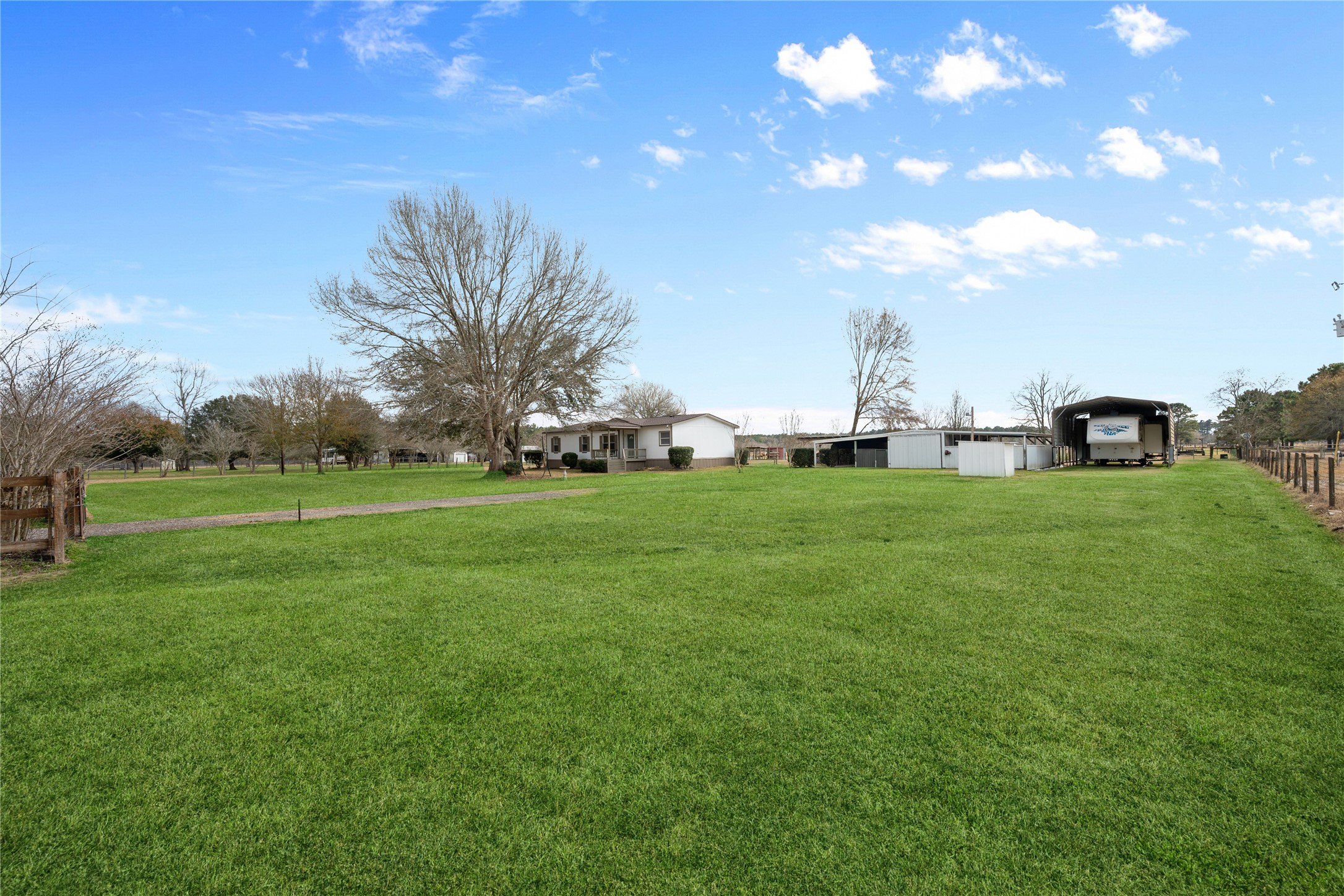 290 County Road 2286 Cleveland, TX 77327 - Photo 3 of 37 Front-right side of property