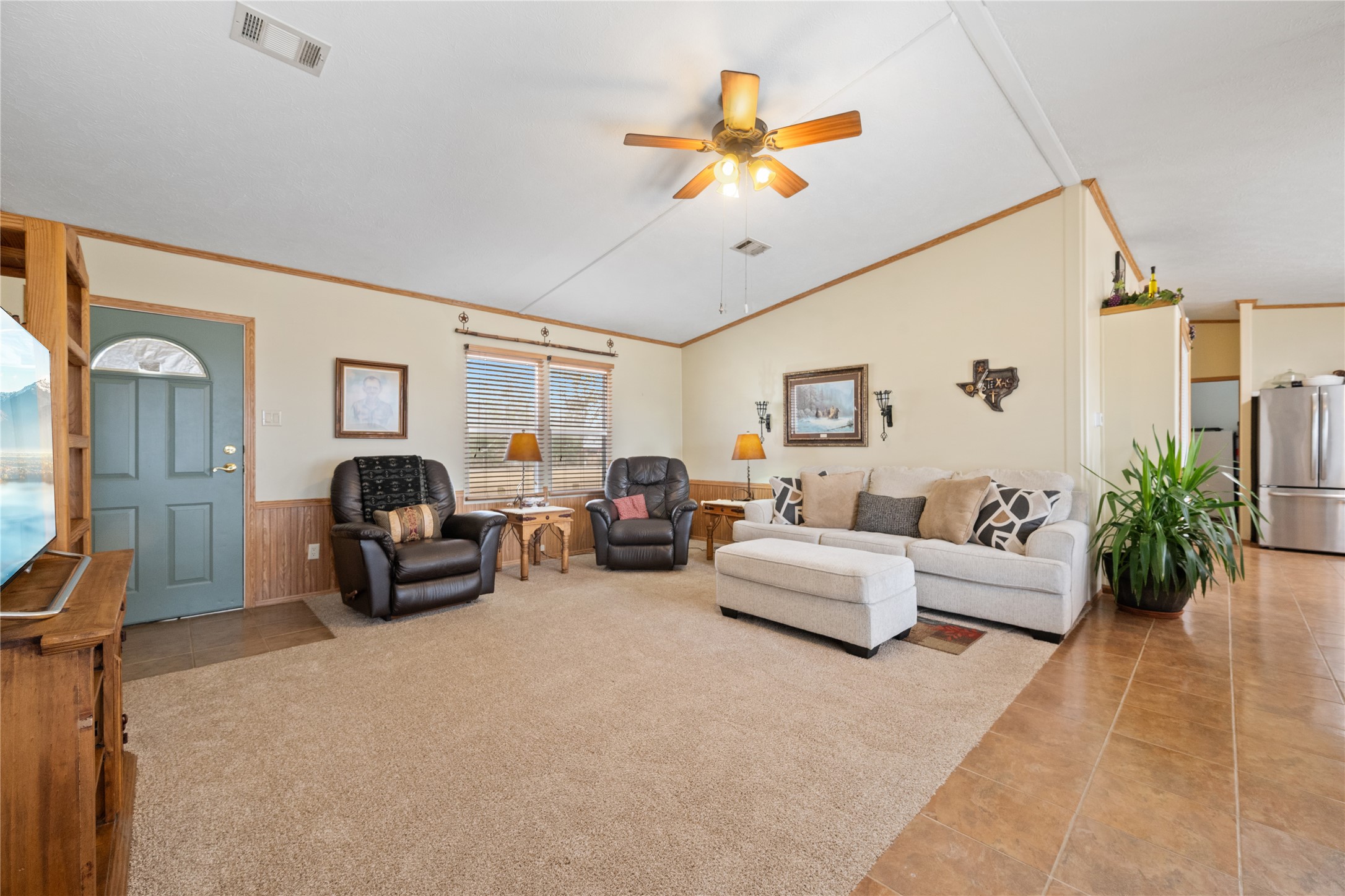 290 County Road 2286 Cleveland, TX 77327 - Photo 5 of 37 a living room with furniture chandelier and a large window