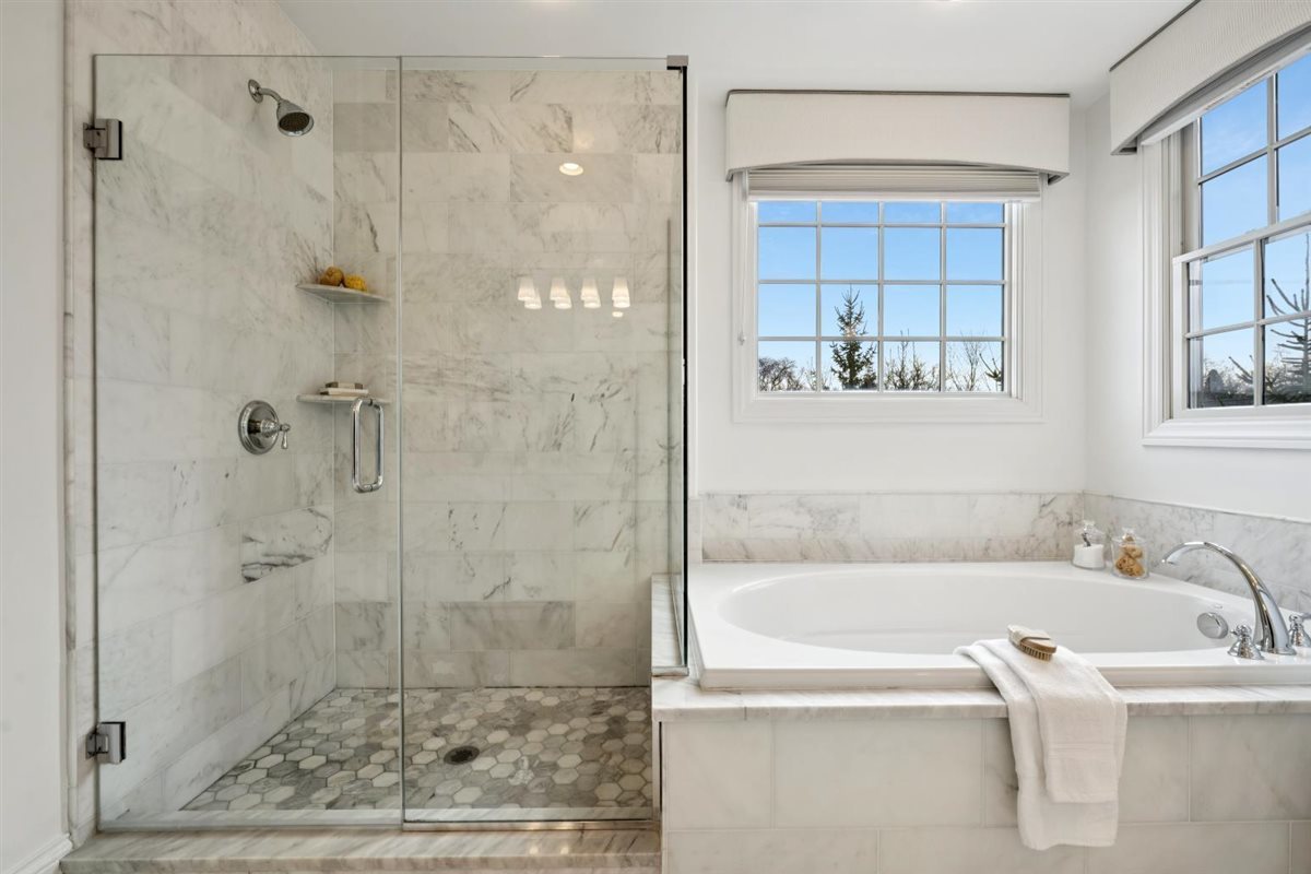 726 Lincoln Street Evanston, IL 60201 - Photo 23 of 46 a bathroom with a bathtub and a shower