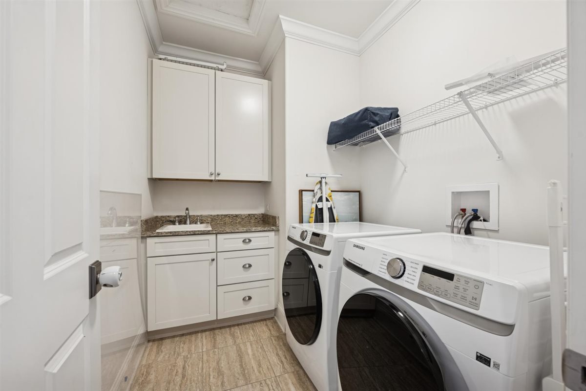 726 Lincoln Street Evanston, IL 60201 - Photo 24 of 46 a view of washer and dryer with kitchen in the background