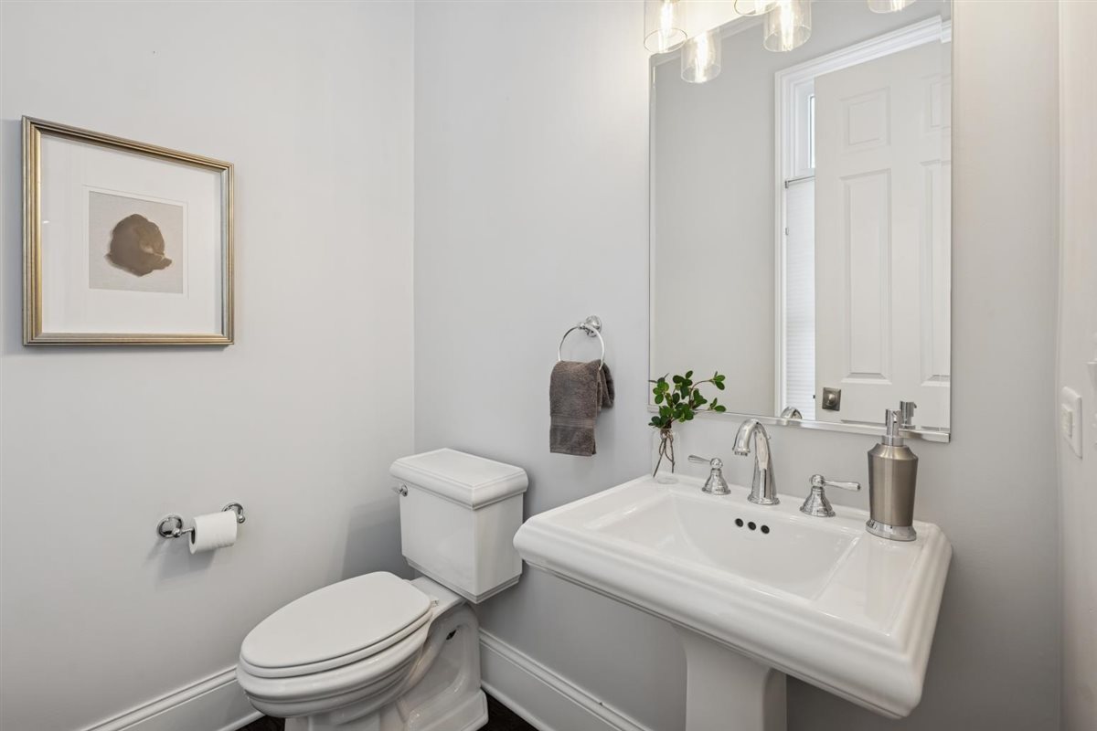 726 Lincoln Street Evanston, IL 60201 - Photo 8 of 46 a bathroom with a sink a toilet and mirror