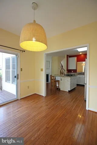 a view of kitchen and dining room with wooden floor