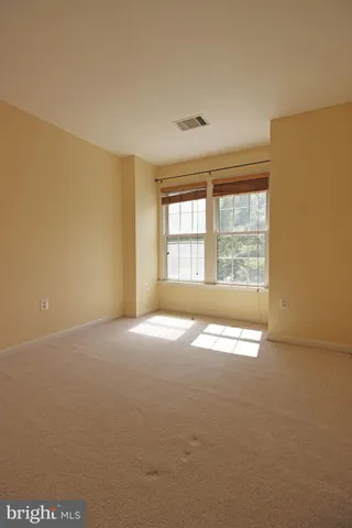 an empty room with an empty space and a window