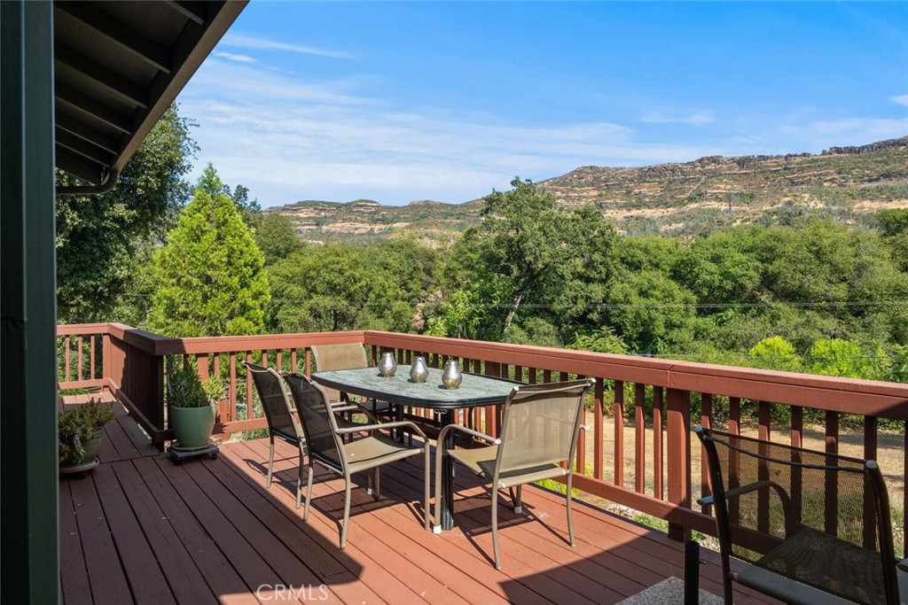 5056 Hooper Lane Chico, CA 95928 - Photo 5 of 57 a balcony with wooden floor outdoor seating and yard in the back