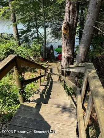 a view of swimming pool with sitting area