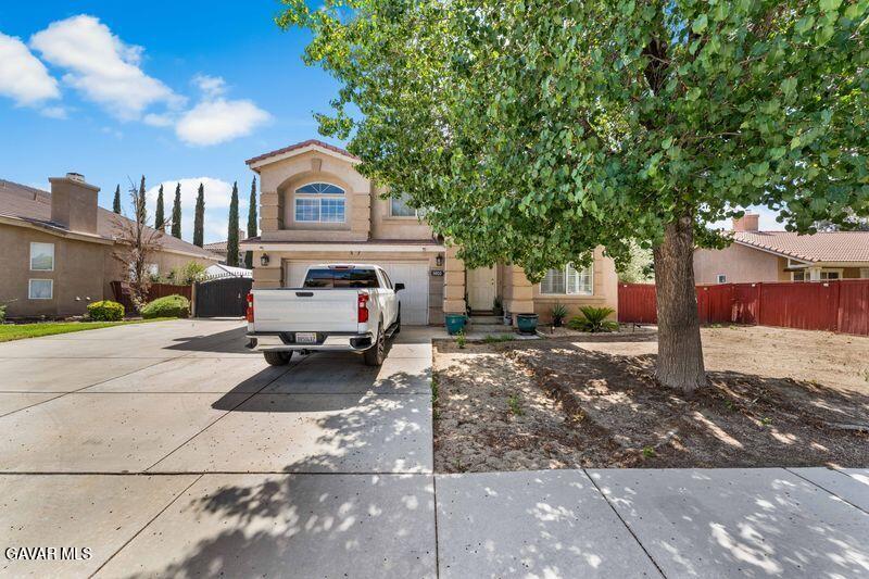 5602 East Ave R 11 Palmdale, CA 93552 - Photo 2 of 27 a car parked in front of a house