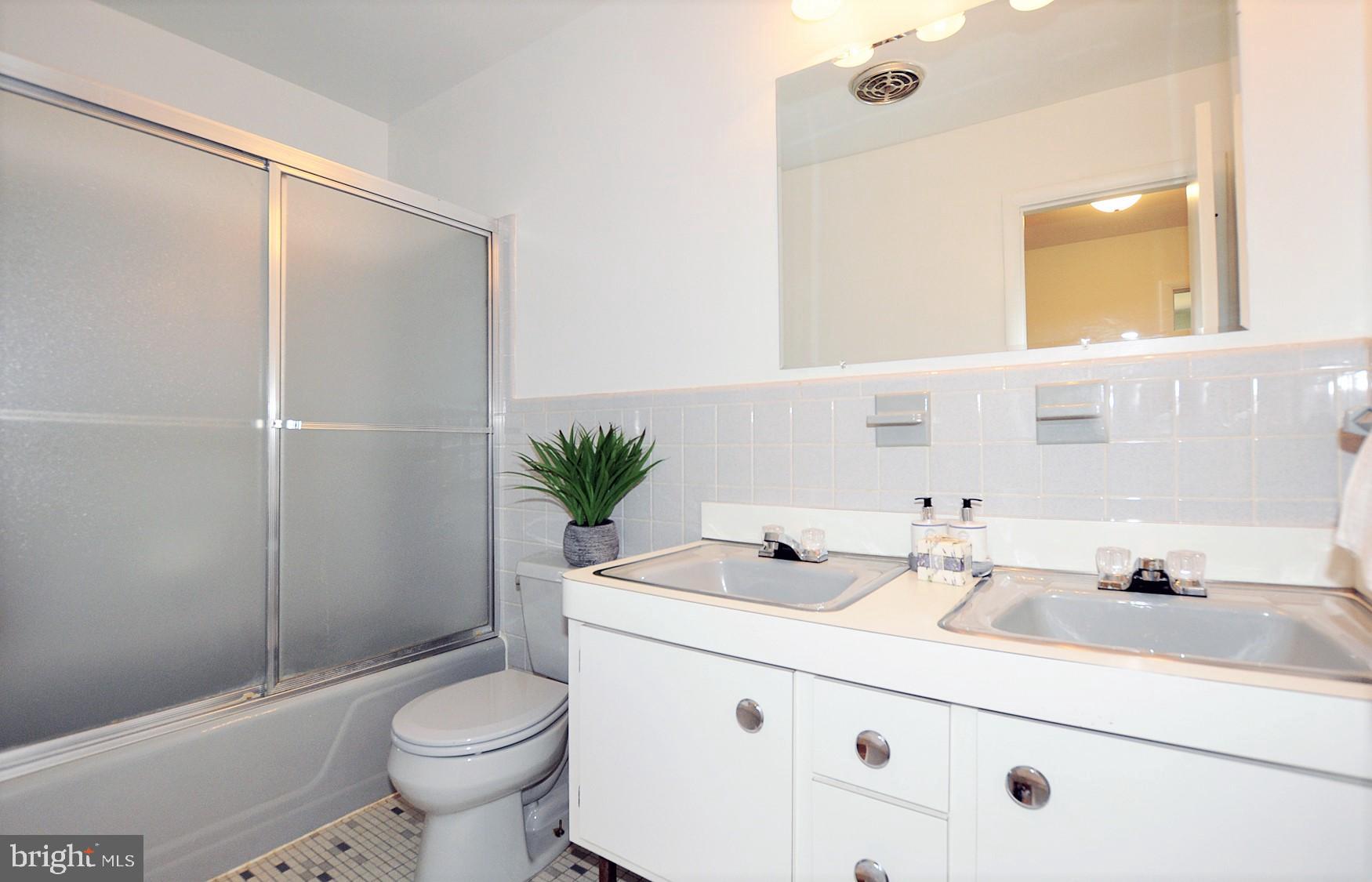 6901 Millwood Road Bethesda, MD 20817 - Photo 22 of 28 Upstairs Hall Bath w/double vanity
