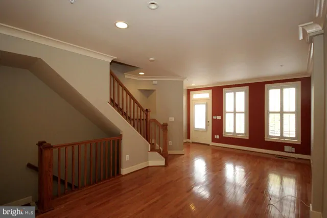 a view of an entryway with wooden floor