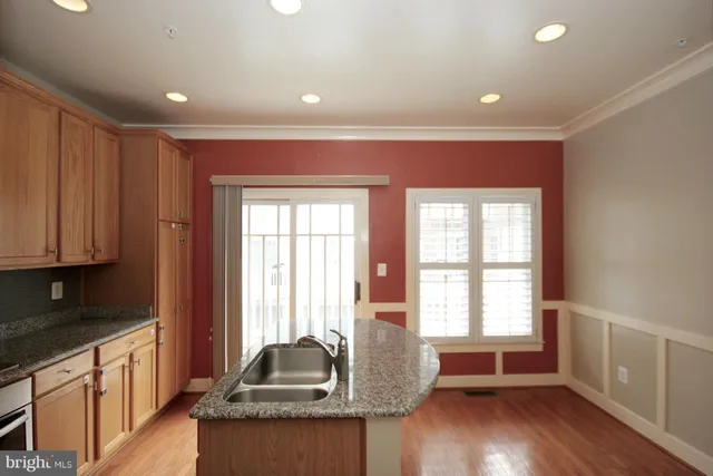 a kitchen with sink and window