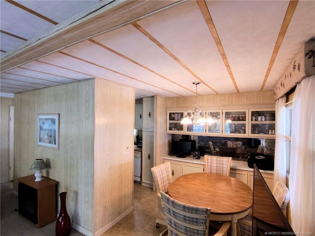 2540 Southeast Penny Lane Stuart, FL 34994 - Photo 11 of 62 a view of a dining room with furniture