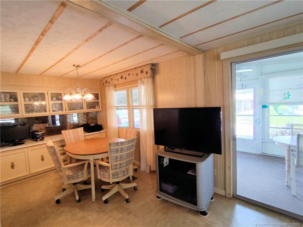 2540 Southeast Penny Lane Stuart, FL 34994 - Photo 12 of 62 a dining room with furniture and wooden floor