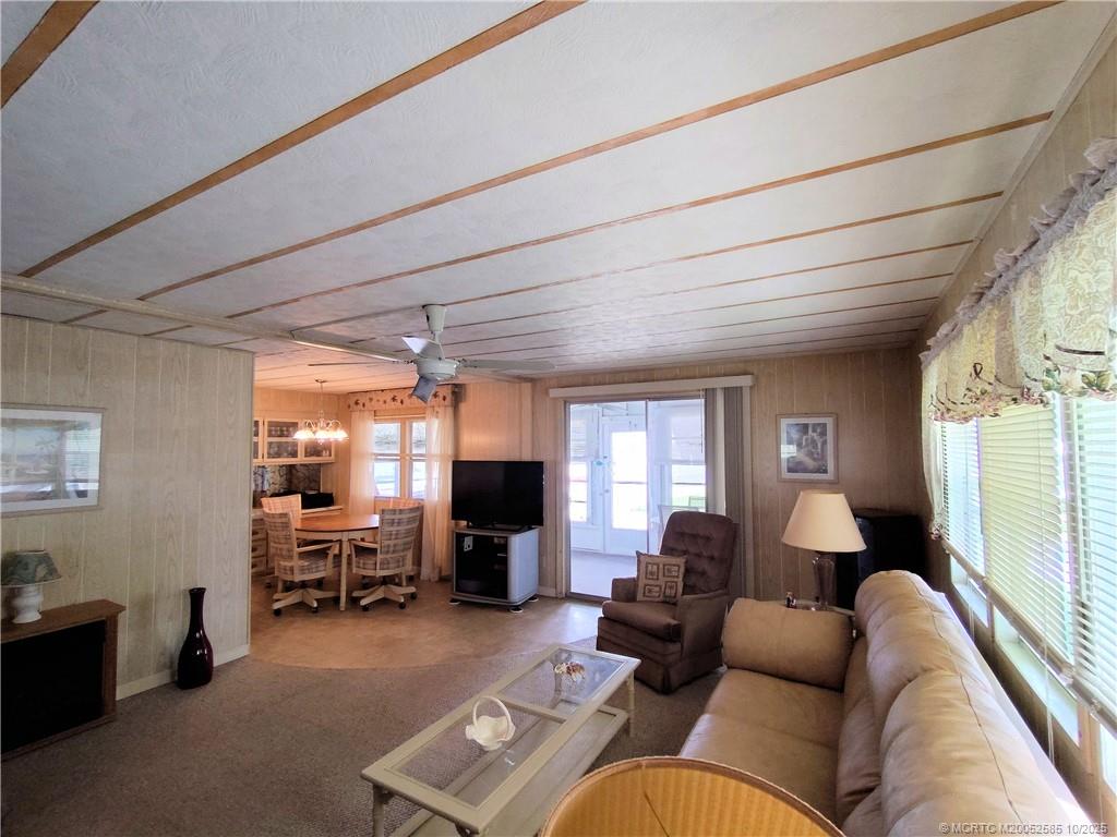 2540 Southeast Penny Lane Stuart, FL 34994 - Photo 19 of 62 a living room with furniture and a flat screen tv