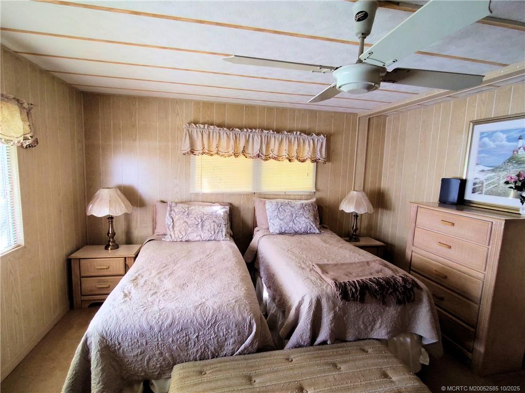 2540 Southeast Penny Lane Stuart, FL 34994 - Photo 22 of 62 a bed room with two bed and a window