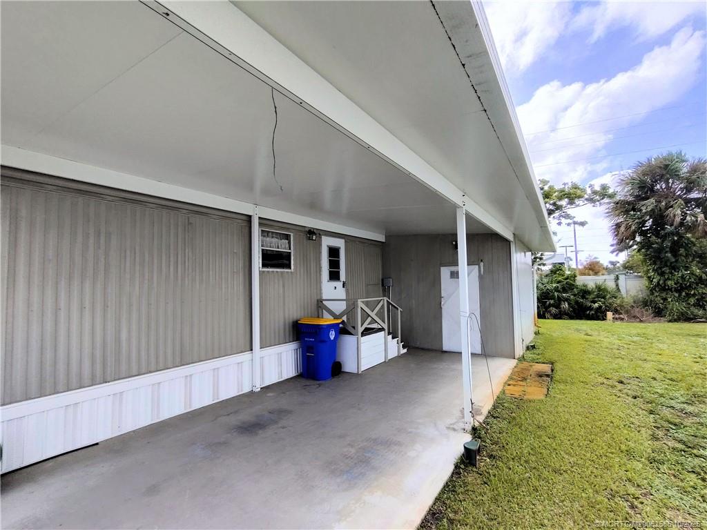 2540 Southeast Penny Lane Stuart, FL 34994 - Photo 4 of 62 a view of a patio with chair and tables