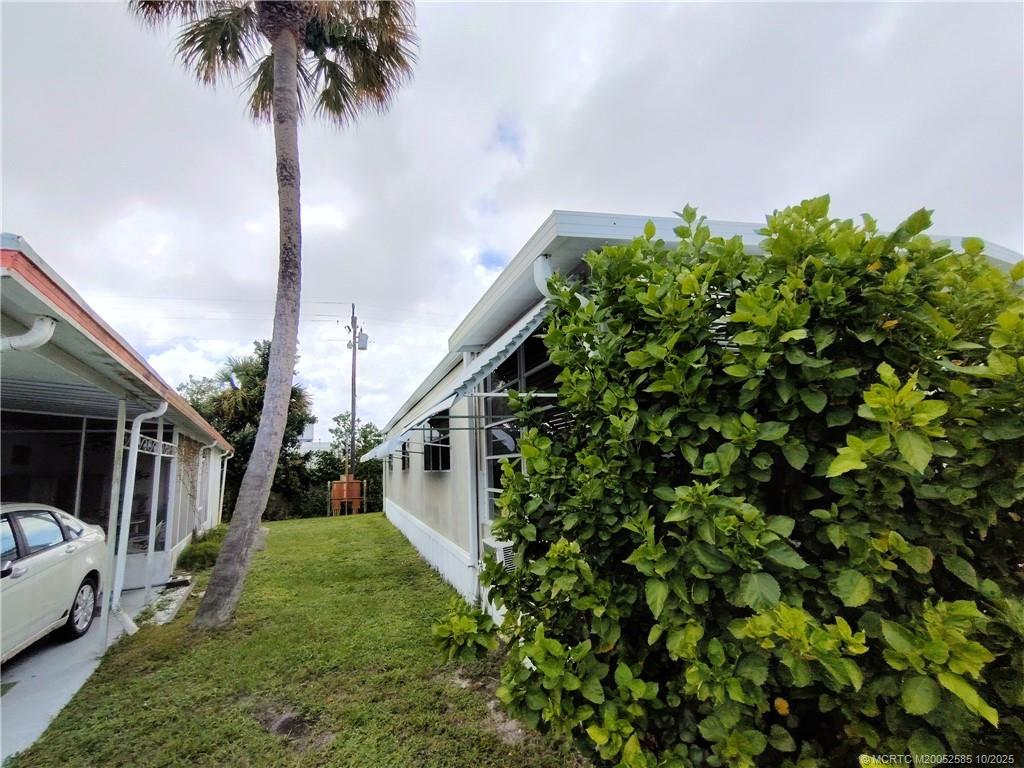 2540 Southeast Penny Lane Stuart, FL 34994 - Photo 42 of 62 a view of an entryway with garden