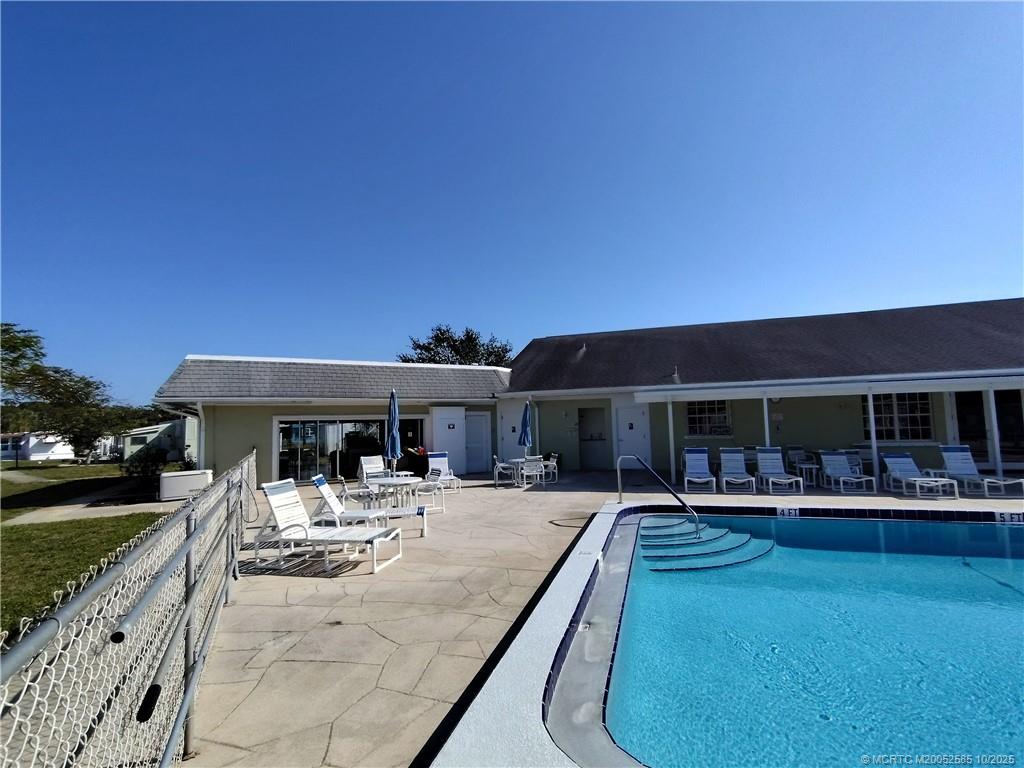 2540 Southeast Penny Lane Stuart, FL 34994 - Photo 50 of 62 a view of a backyard with a patio and dining space