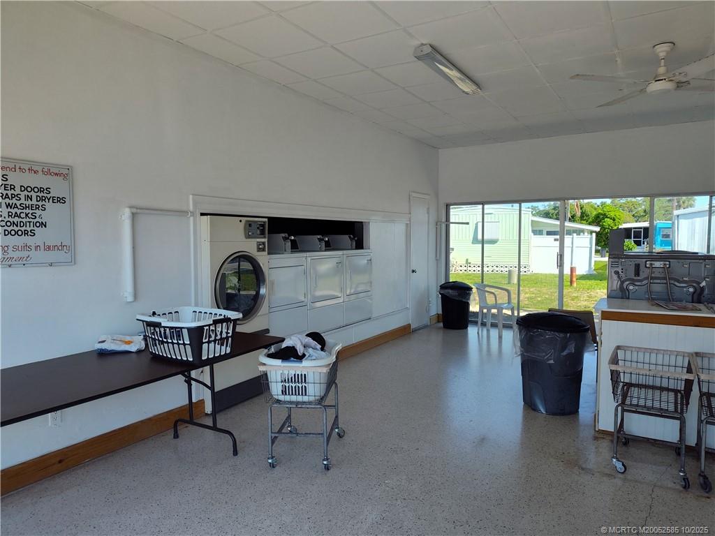 2540 Southeast Penny Lane Stuart, FL 34994 - Photo 55 of 62 a living room with furniture and a large window