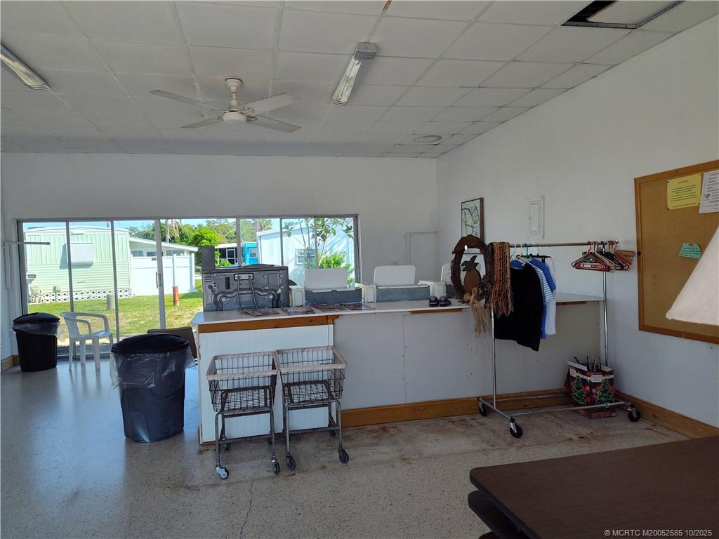 2540 Southeast Penny Lane Stuart, FL 34994 - Photo 56 of 62 a room with furniture and a flat screen tv