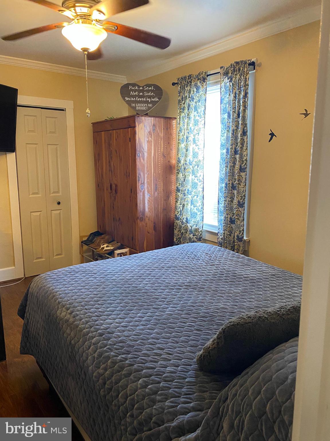 2419 Newcombtown Road Millville, NJ 08332 - Photo 20 of 34 a bedroom with a bed and a chandelier