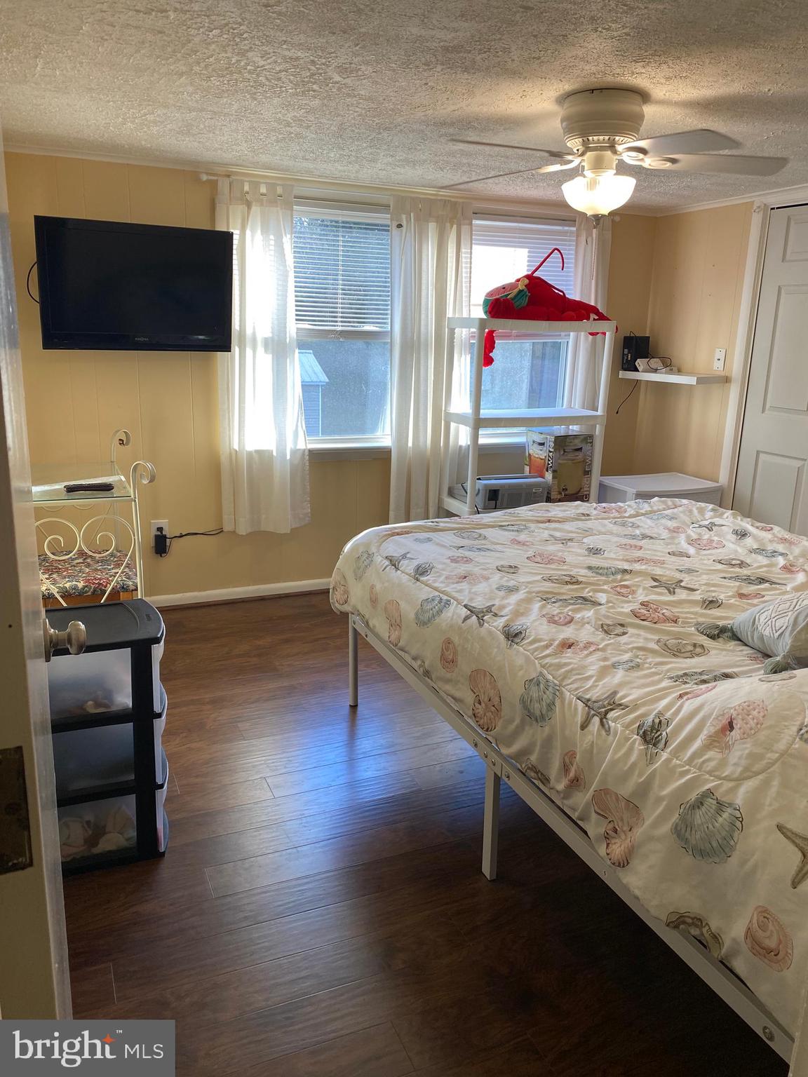 2419 Newcombtown Road Millville, NJ 08332 - Photo 22 of 34 a bedroom with a bed and a television