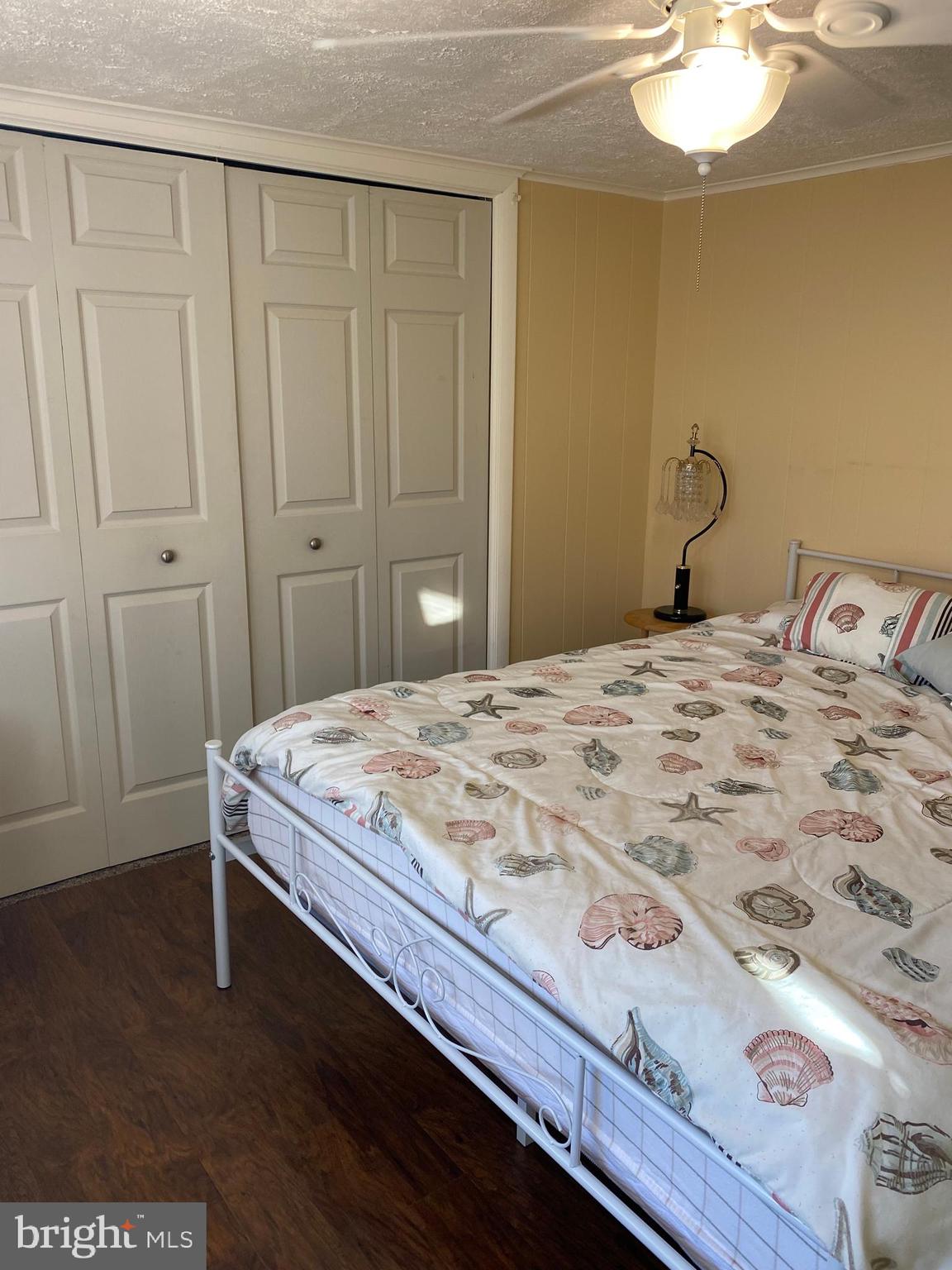 2419 Newcombtown Road Millville, NJ 08332 - Photo 23 of 34 a bedroom with a bed and a chandelier
