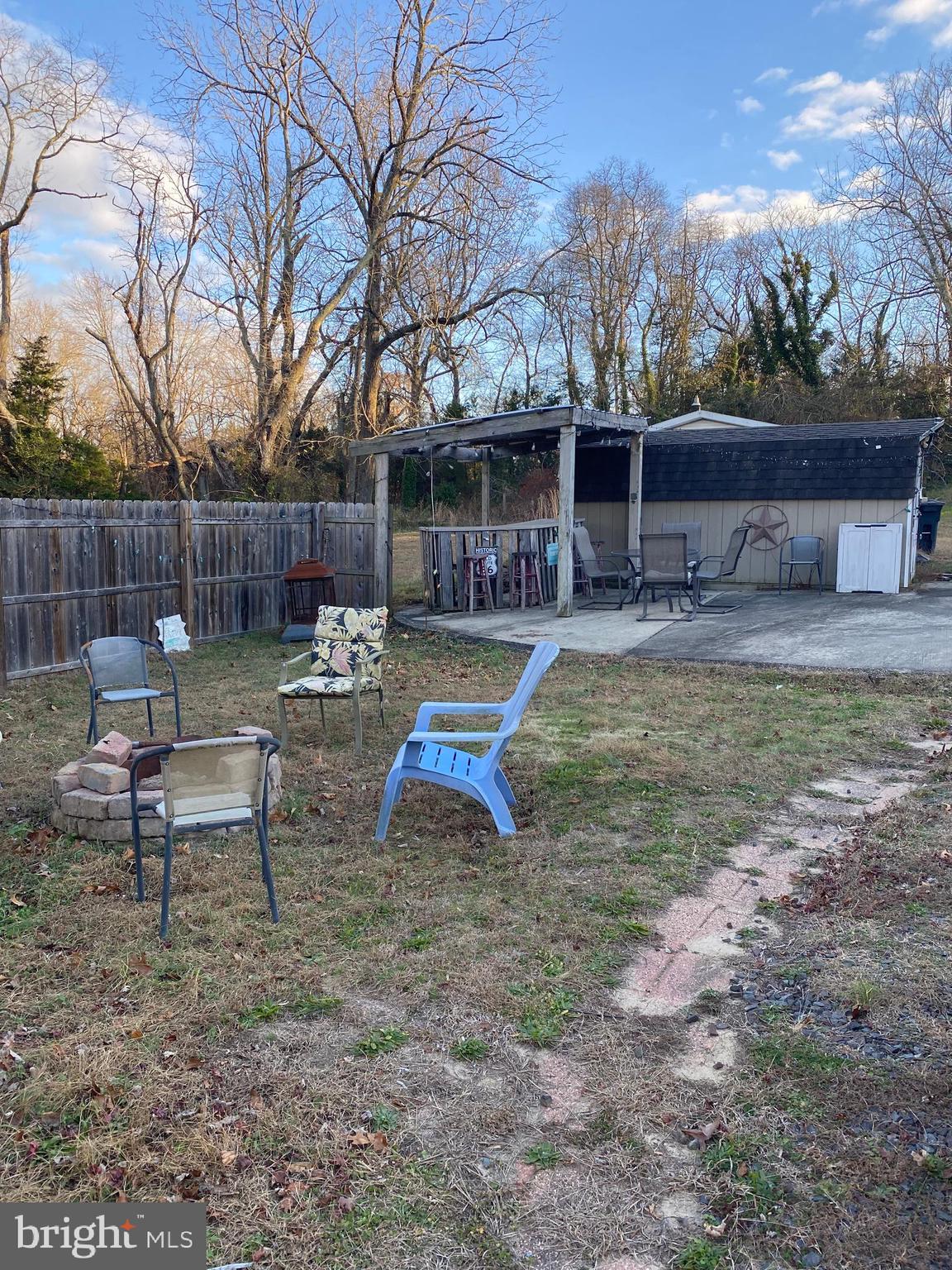 2419 Newcombtown Road Millville, NJ 08332 - Photo 27 of 34 a view of a backyard with a patio and fire pit