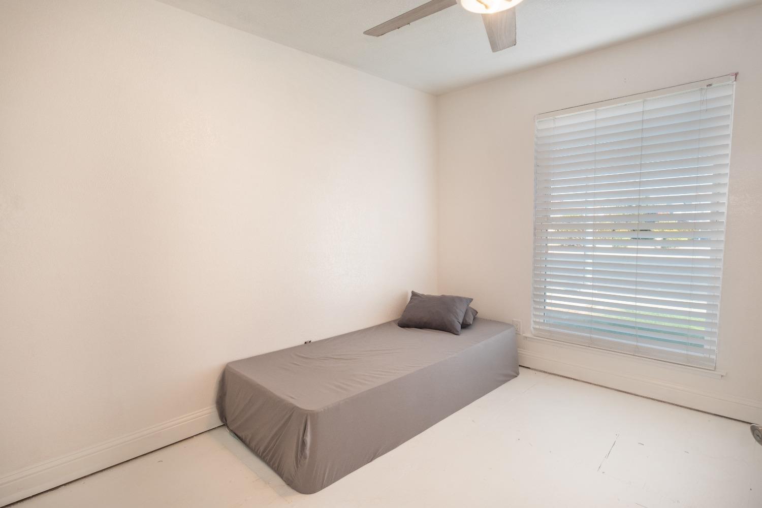 172 West Swift Avenue Clovis, CA 93612 - Photo 14 of 22 a bedroom with a bed and a window