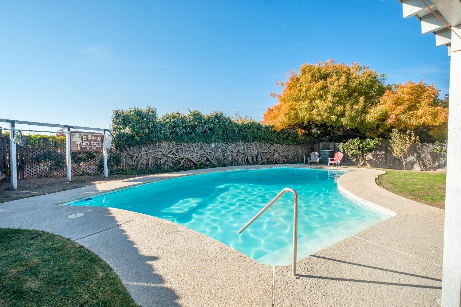 172 West Swift Avenue Clovis, CA 93612 - Photo 17 of 22 a view of a swimming pool with a patio