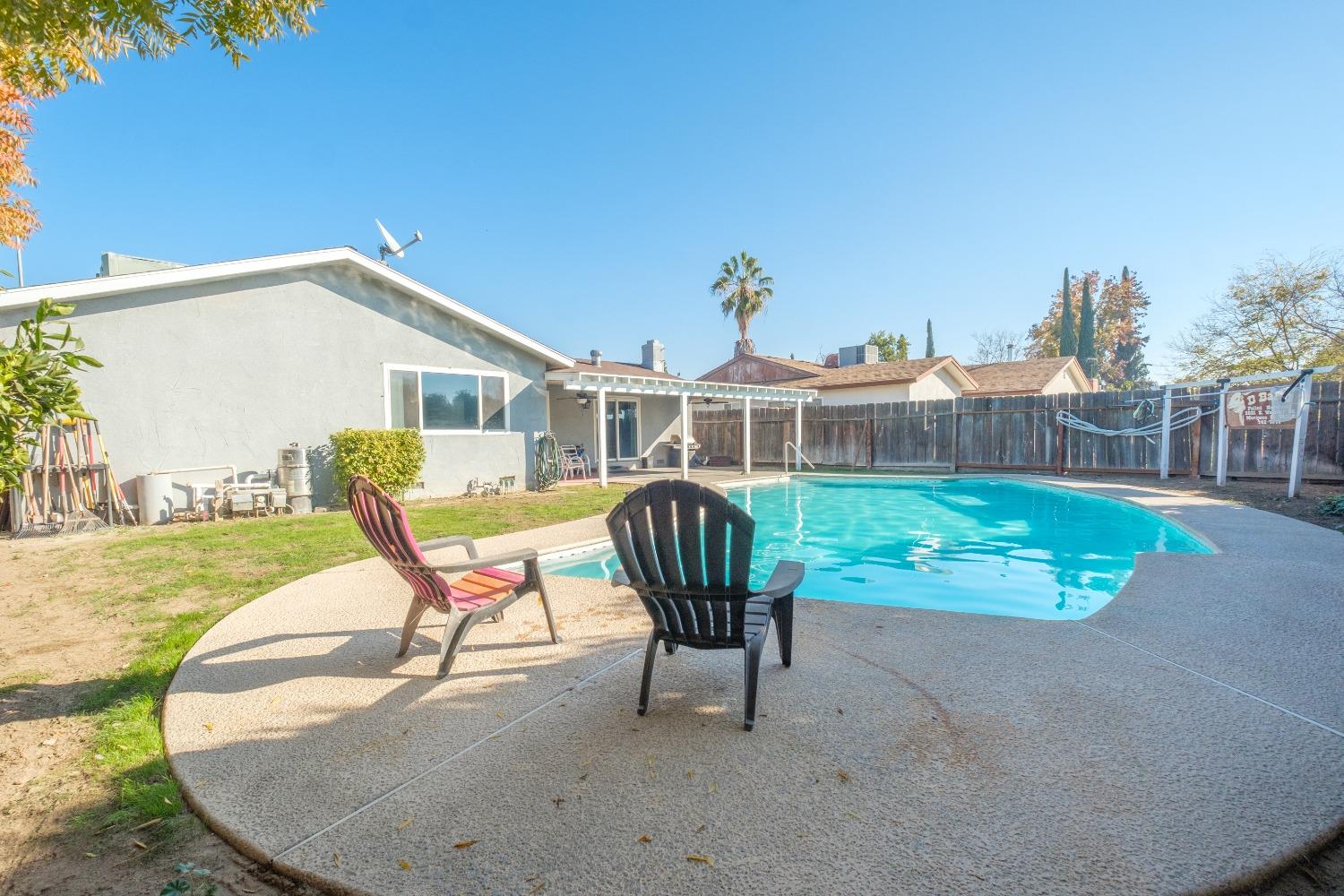 172 West Swift Avenue Clovis, CA 93612 - Photo 19 of 22 a view of a house with backyard porch and sitting area