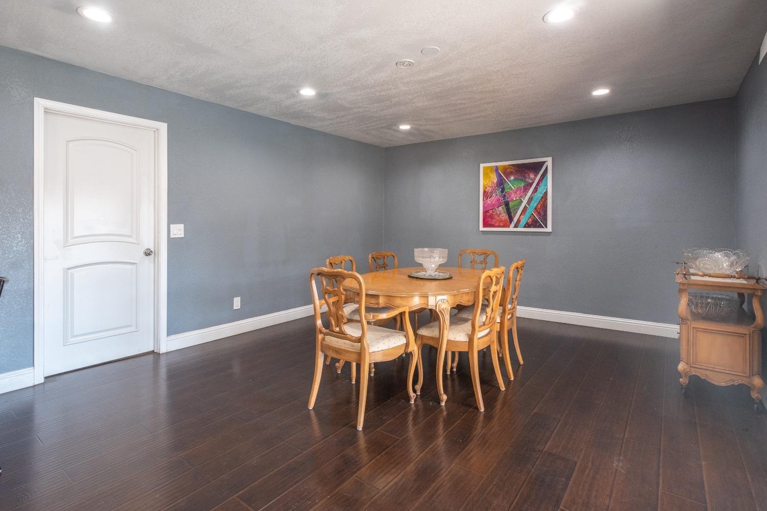 172 West Swift Avenue Clovis, CA 93612 - Photo 8 of 22 a view of a dining room with furniture and wooden floor