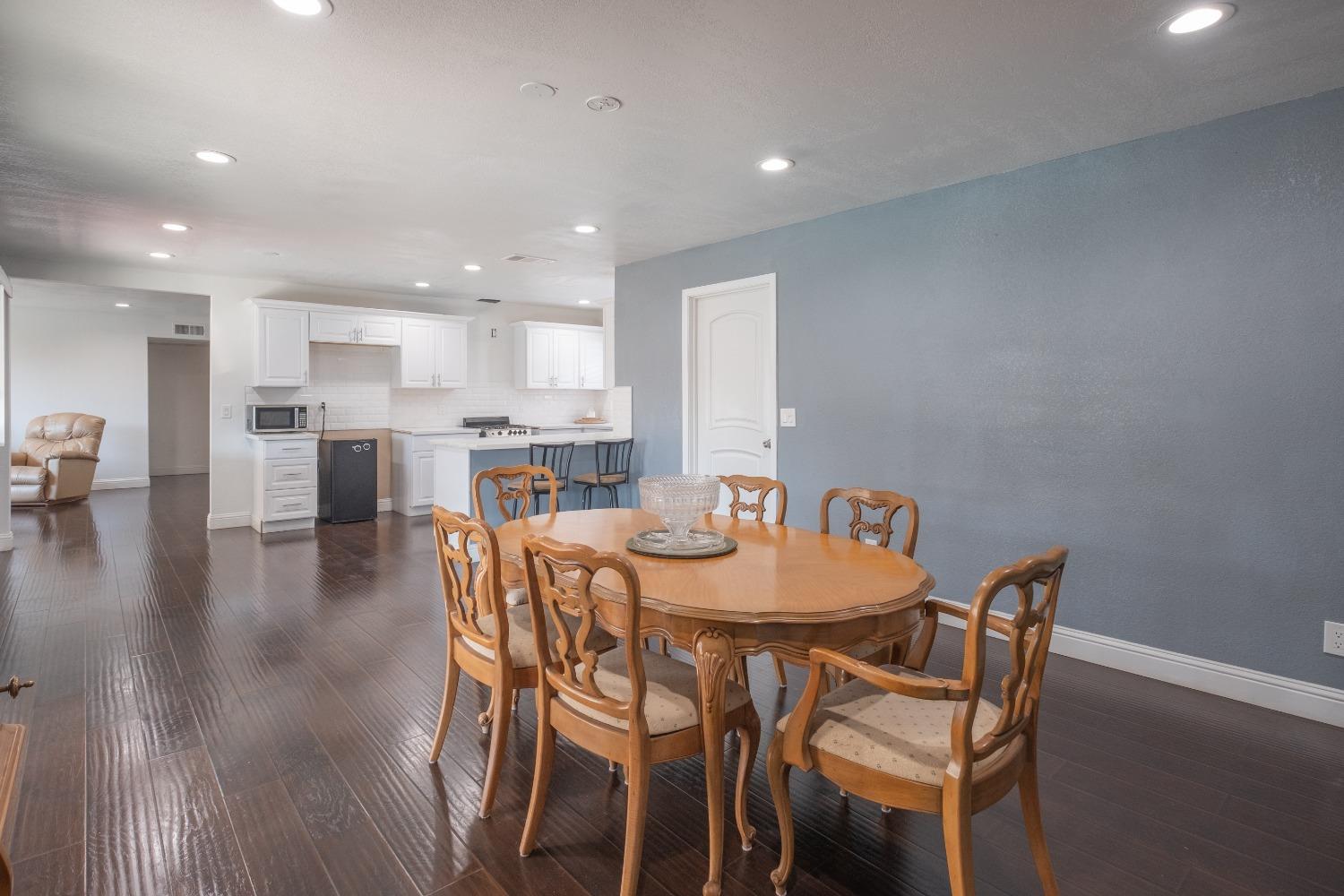 172 West Swift Avenue Clovis, CA 93612 - Photo 9 of 22 a dining room with furniture and wooden floor