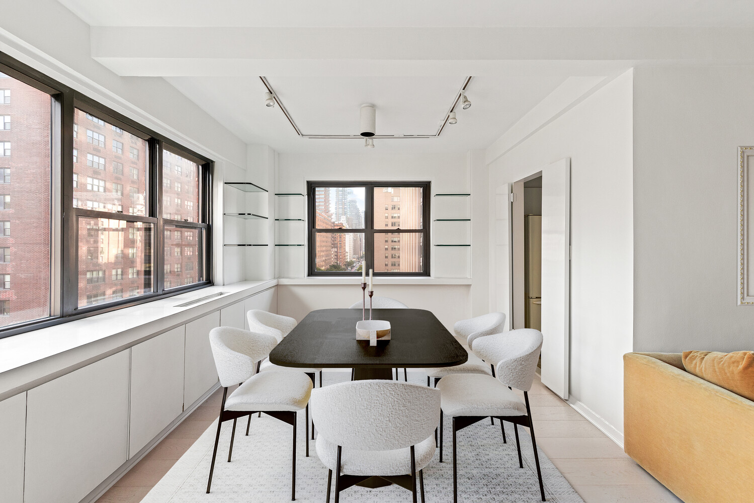 165 East 72nd Street, Unit 11C Manhattan, NY 10021 - Photo 3 of 12 a view of a dining room with furniture and window