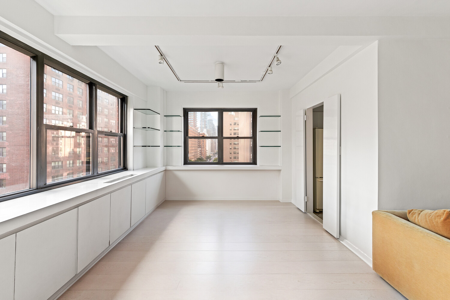 165 East 72nd Street, Unit 11C Manhattan, NY 10021 - Photo 4 of 12 a view of an empty room with a window