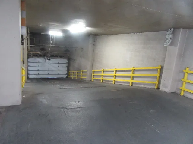 an aerial view of residential building and ocean view