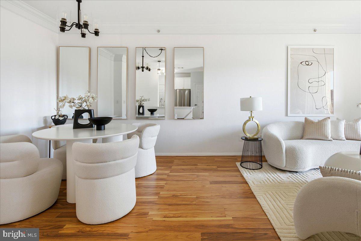 1591 Spring Gate Dr., Unit 3406 McLean, VA 22102 - Photo 12 of 45 a living room with furniture and a large mirror