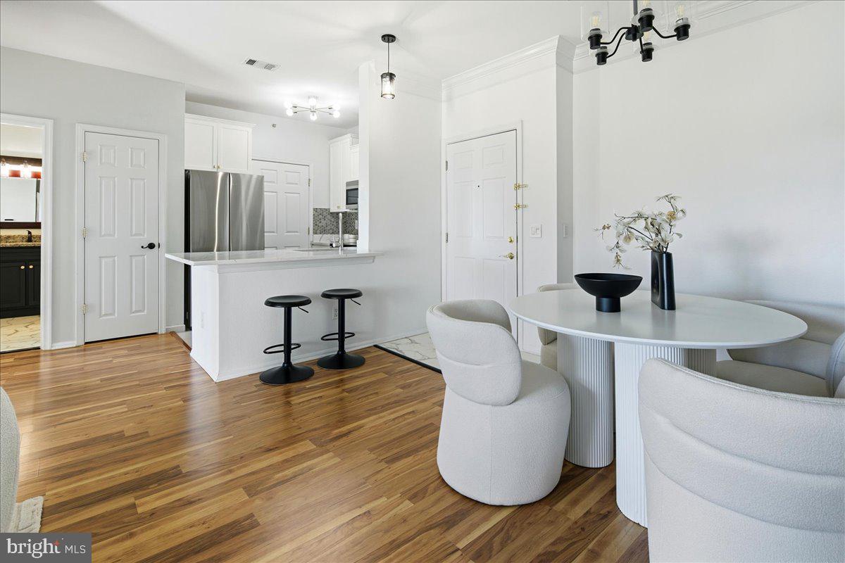 1591 Spring Gate Dr., Unit 3406 McLean, VA 22102 - Photo 13 of 45 a view of kitchen with furniture and wooden floor