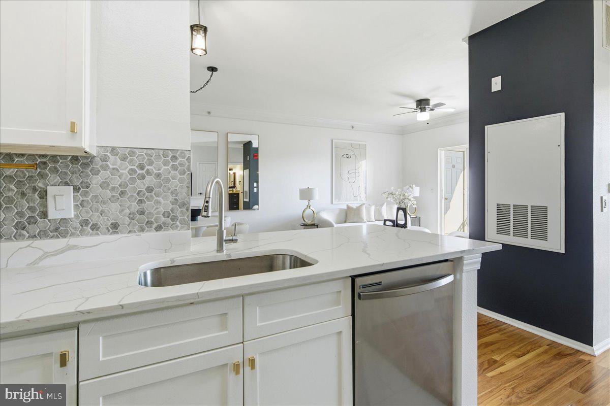 1591 Spring Gate Dr., Unit 3406 McLean, VA 22102 - Photo 25 of 45 a kitchen with a sink and a refrigerator