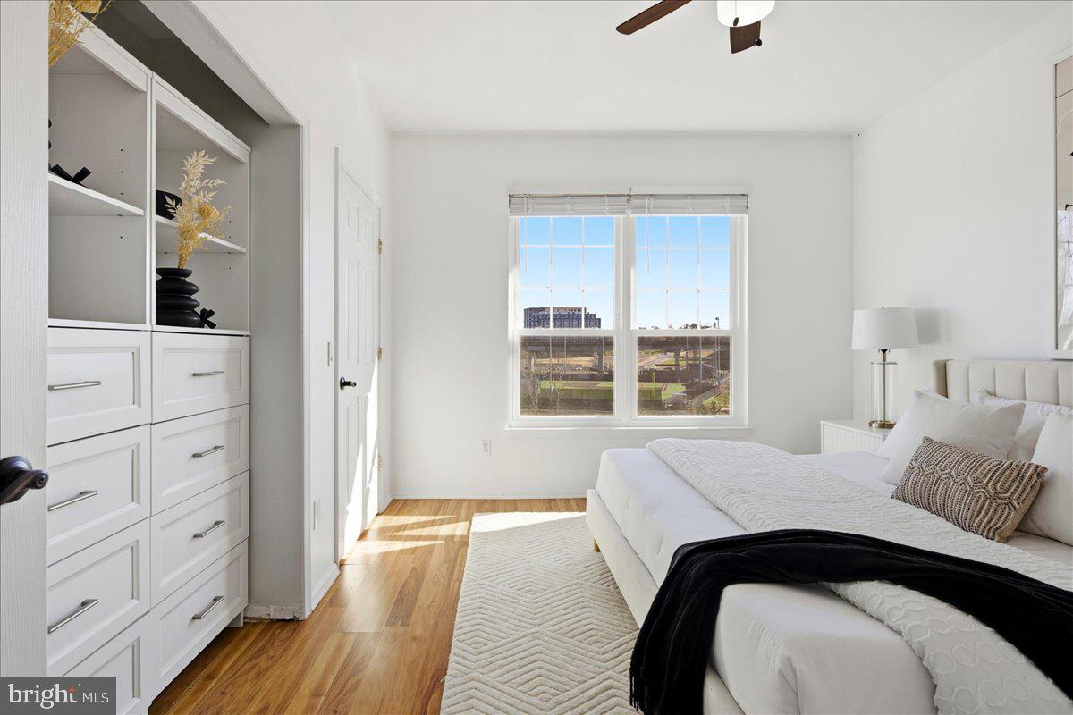 1591 Spring Gate Dr., Unit 3406 McLean, VA 22102 - Photo 30 of 45 a bedroom with a bed and a dresser