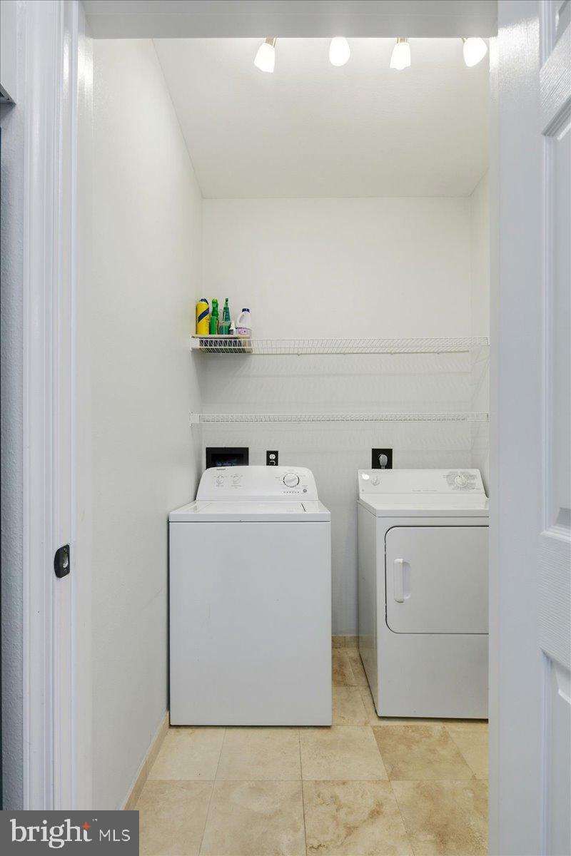 1591 Spring Gate Dr., Unit 3406 McLean, VA 22102 - Photo 35 of 45 a utility room with dryer and washer