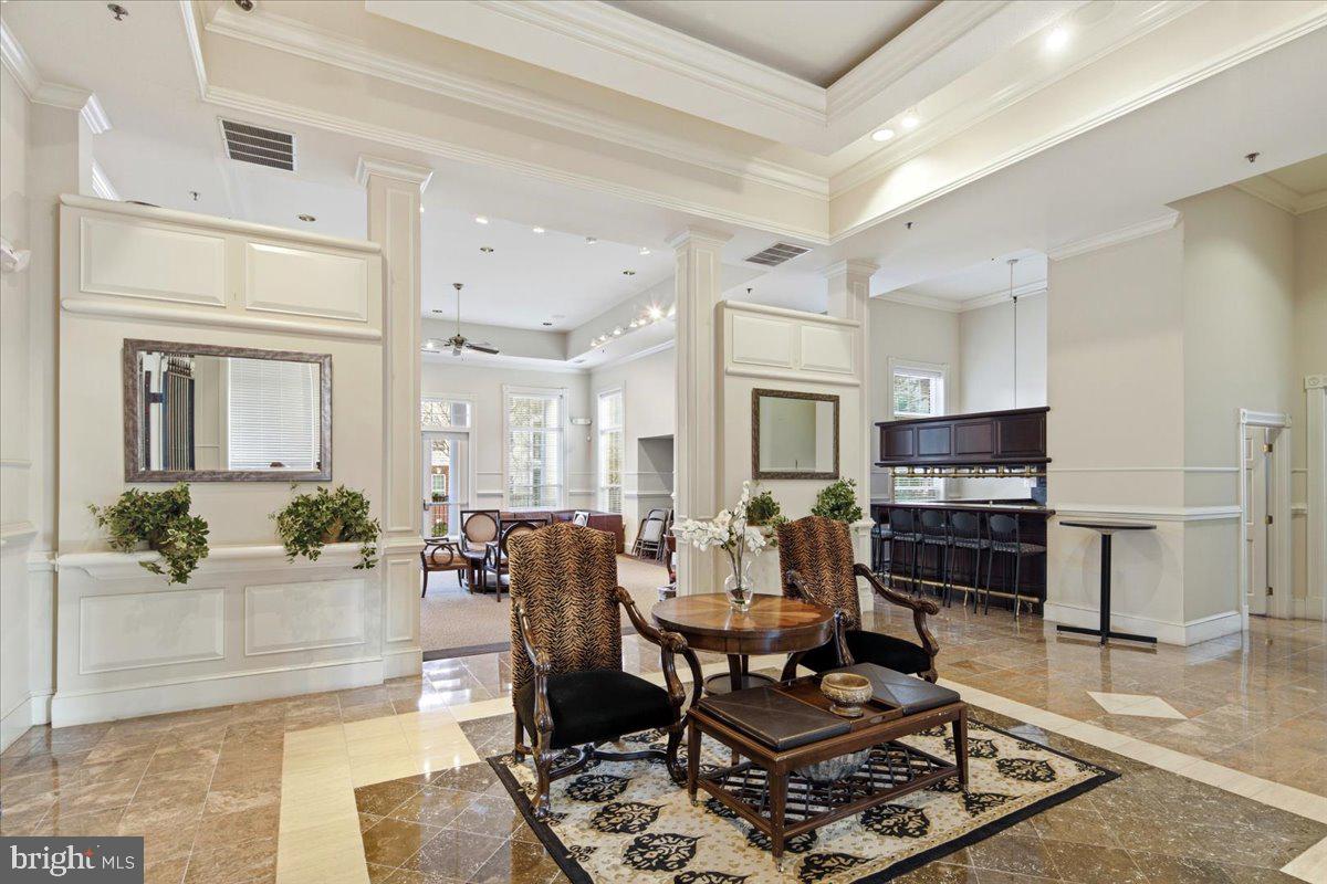 1591 Spring Gate Dr., Unit 3406 McLean, VA 22102 - Photo 41 of 45 a living room with furniture and a fireplace