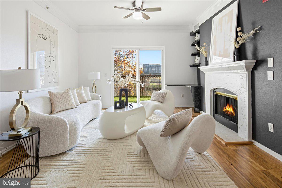 1591 Spring Gate Dr., Unit 3406 McLean, VA 22102 - Photo 5 of 45 a living room with furniture and a fireplace