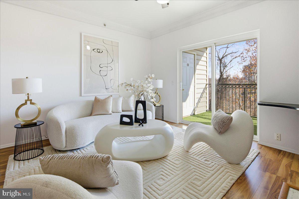 1591 Spring Gate Dr., Unit 3406 McLean, VA 22102 - Photo 7 of 45 a living room with furniture and a large window